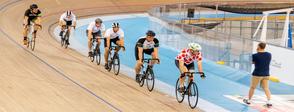 group of adults riding on the cycling track