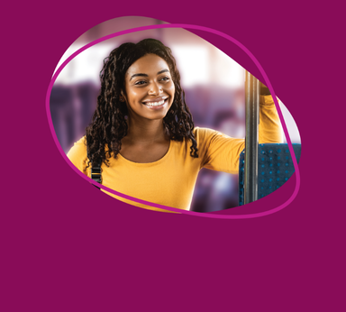 Two busses parked facing each other with a blue sky in the background