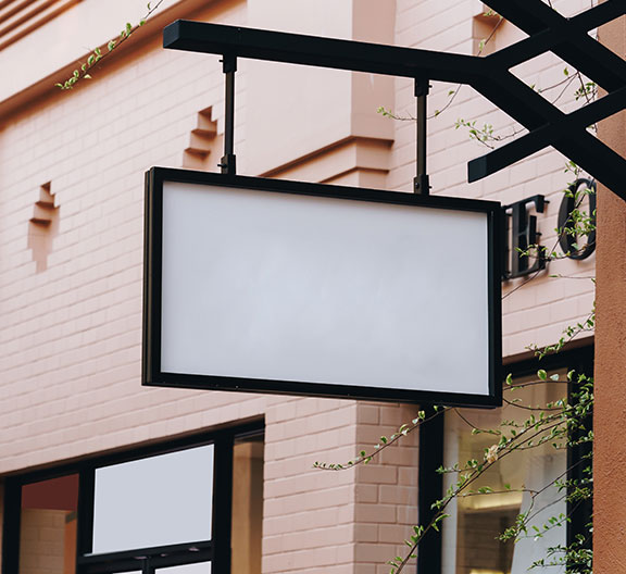 Signs on a wall and on windows.