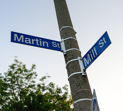 A post with two street name signs on it